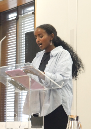 Mariam Bafo adressing the MPs and Young People to start the event