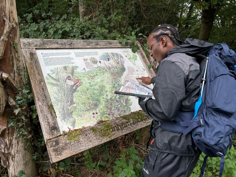 Young person reading a map on Duke of Edinburgh Expedition