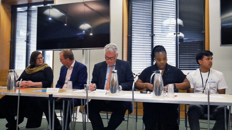 Panel of MP hosts Meg Hillier, Tim Farron, Tim Loughton sitting alongsde We Belong CEO Chrisann Jarrett MBE and Young Speaker Santiago.